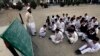 Students attend class at the Musa Neka Public School in Wana, the main town in Pakistan's South Waziristan tribal region bordering Afghanistan November 28, 2012. In a Pakistan army base high in the mountains on the Afghan frontier, a general explains a st