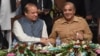 Sacked Pakistani prime minister Nawaz Sharif (L) shakes hands with his brother and Chief Minister of Punjab province Shahbaz Sharif during the PML-N Workers convention in Lahore on October 4, 2017. The Supreme Court deposed Sharif in July following an i