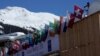 A worker shovels snow from the roof of the congress centre during the World Economic Forum (WEF) annual meeting in Davos, Switzerland