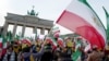 People demonstrate in support of protests across Iran, Jan. 6, 2018, in front of the Brandenburg Gate in Berlin.