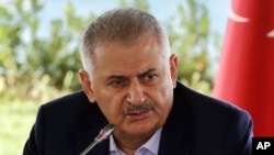 Turkish Prime Minister Binali Yildirim speaks during a meeting with foreign media representatives in Istanbul, Aug. 20, 2016.