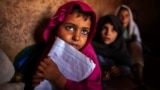 Girls attend lessons at a school in a slum on the outskirts of Islamabad October 11, 2013. REUTERS/Zohra Bensemra (PAKISTAN - Tags: EDUCATION SOCIETY POVERTY TPX IMAGES OF THE DAY) - RTX1472X